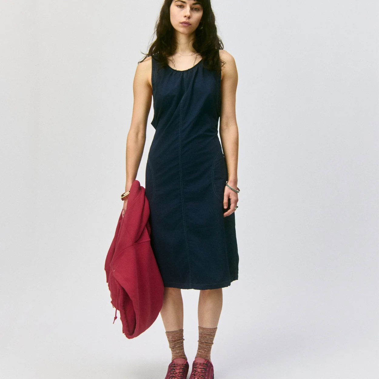 Gramicci navy dress and red shoes worn by a model