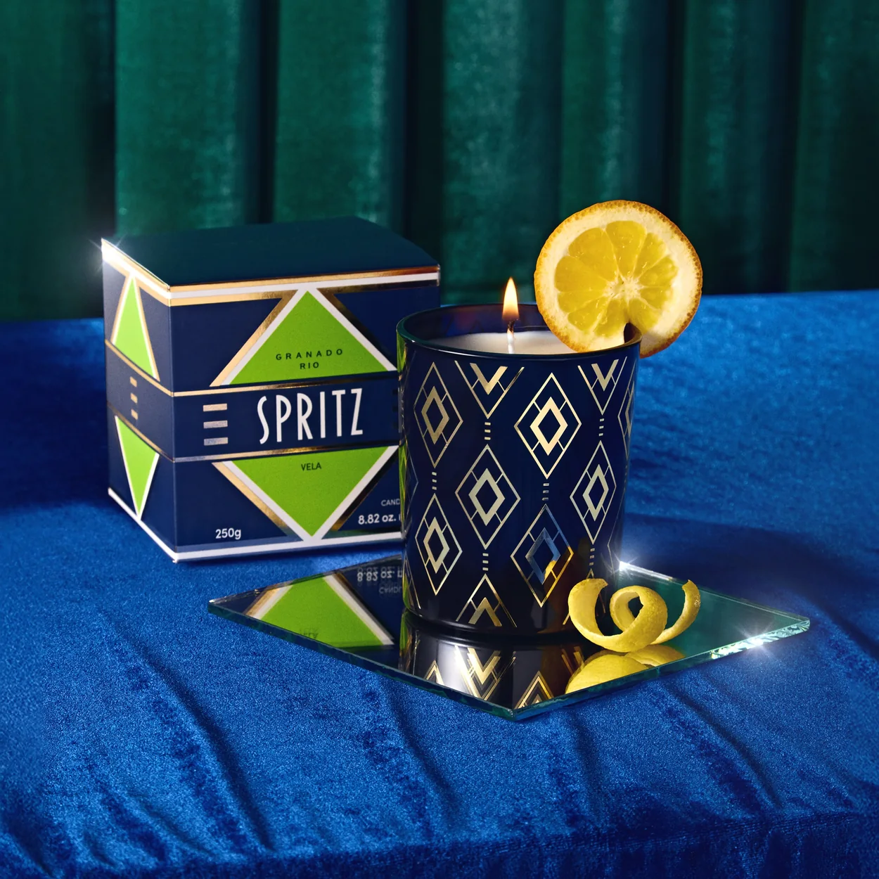 Granado Spritz scented candle and patterned box on blue velvet