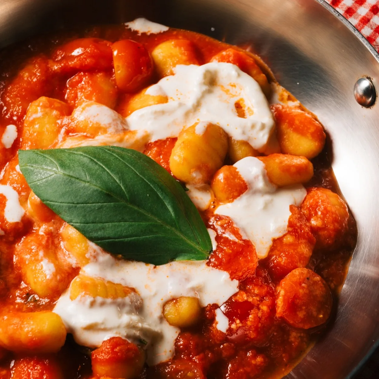 Guido's gnocchi in tomato sauce with burrata and fresh basil