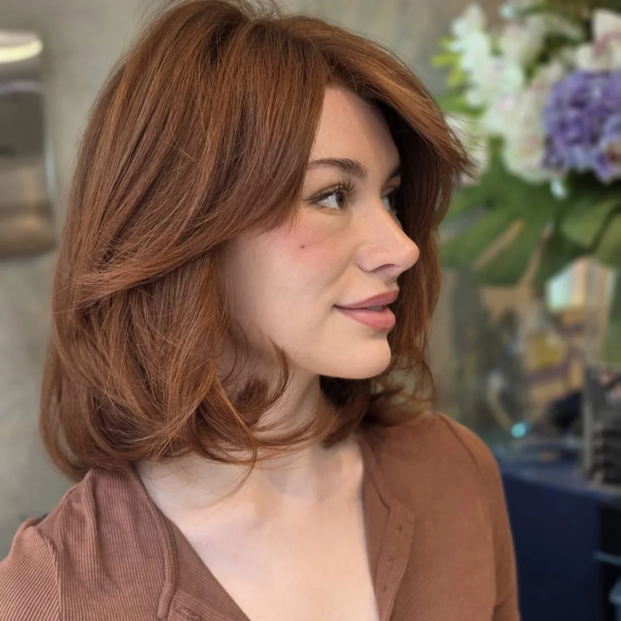 Gusto Hairdressing copper colour and layered cut in profile