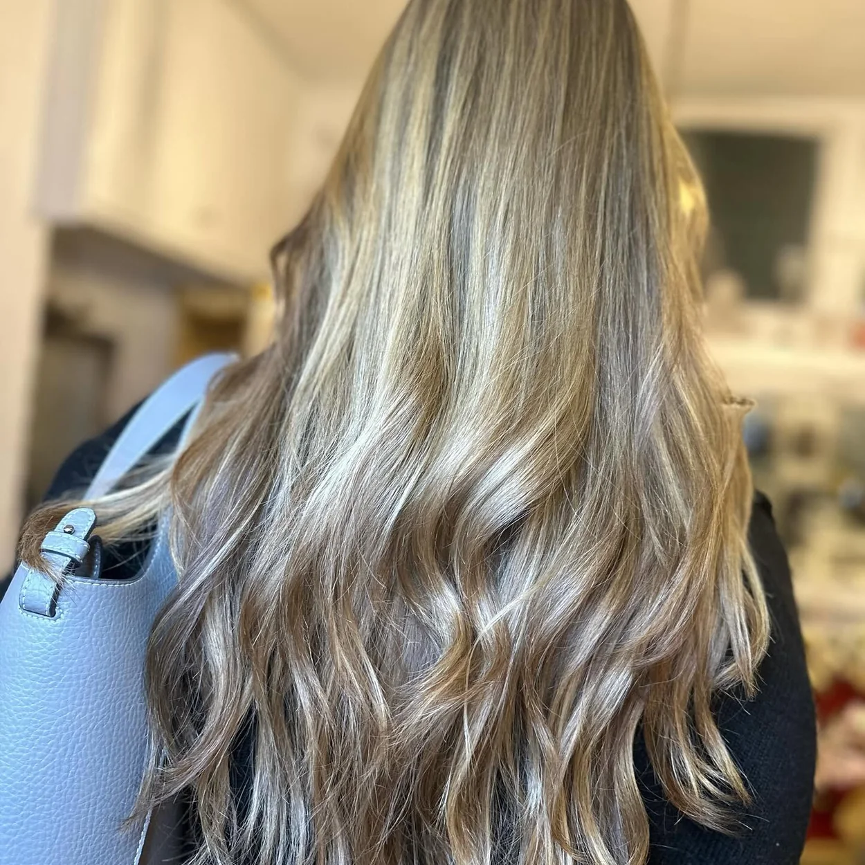 Hair by Fairy long blonde waves styled in the salon
