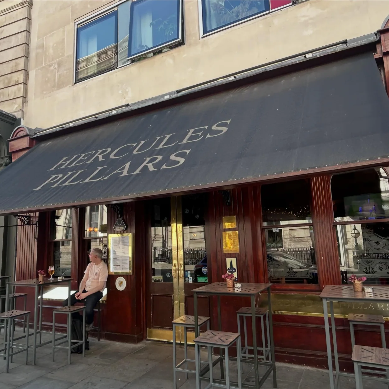 Exterior of The Hercules Pillars on Great Queen Street, Holborn, with its black awning