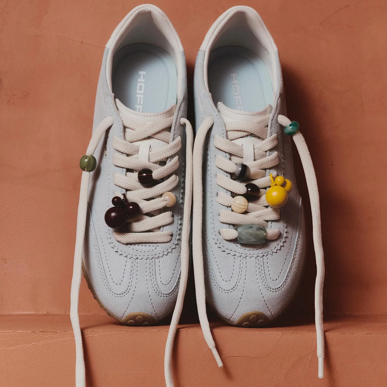 Hoff white trainers decorated with shoe charms