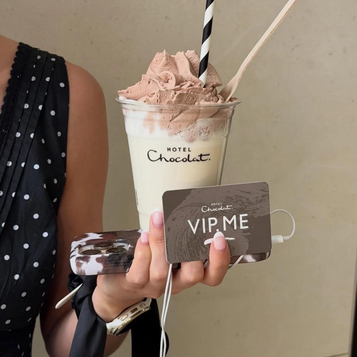 Hotel Chocolat iced chocolate drink with whipped topping in a branded cup