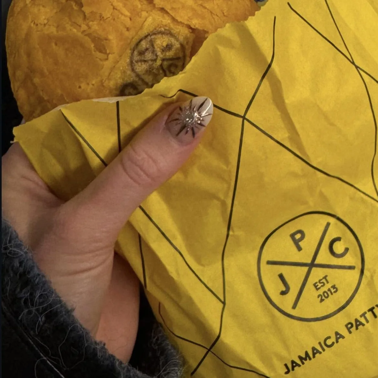 Jamaica Patty Co flaky patty in JPC branded paper