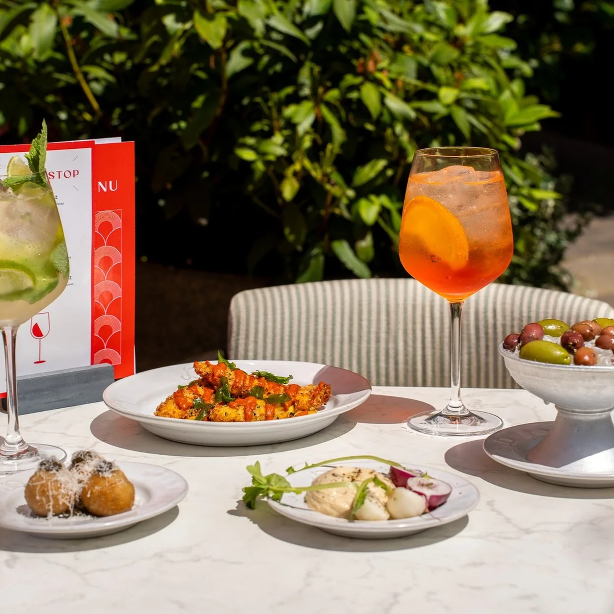 Jamie Oliver Catherine St terrace table with spritzes and sharing plates