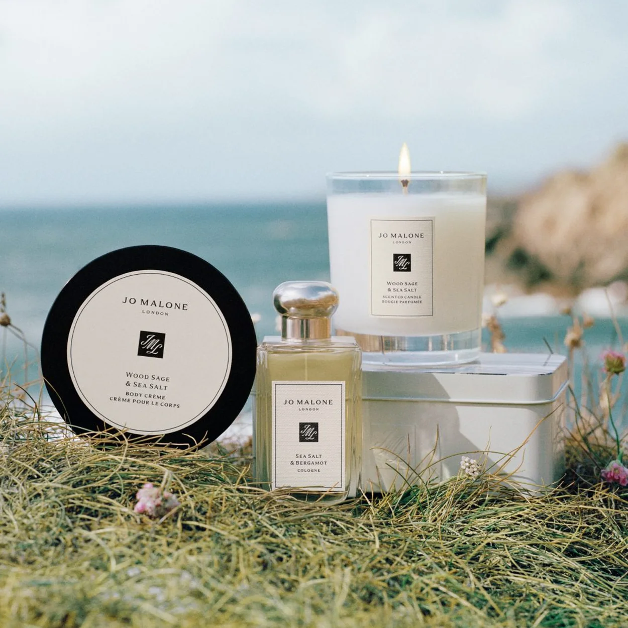 Jo Malone London candle, body creme and cologne set on the grass