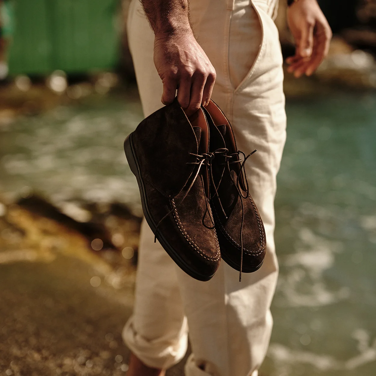 Joseph Cheaney brown suede chukka boots carried by the sea