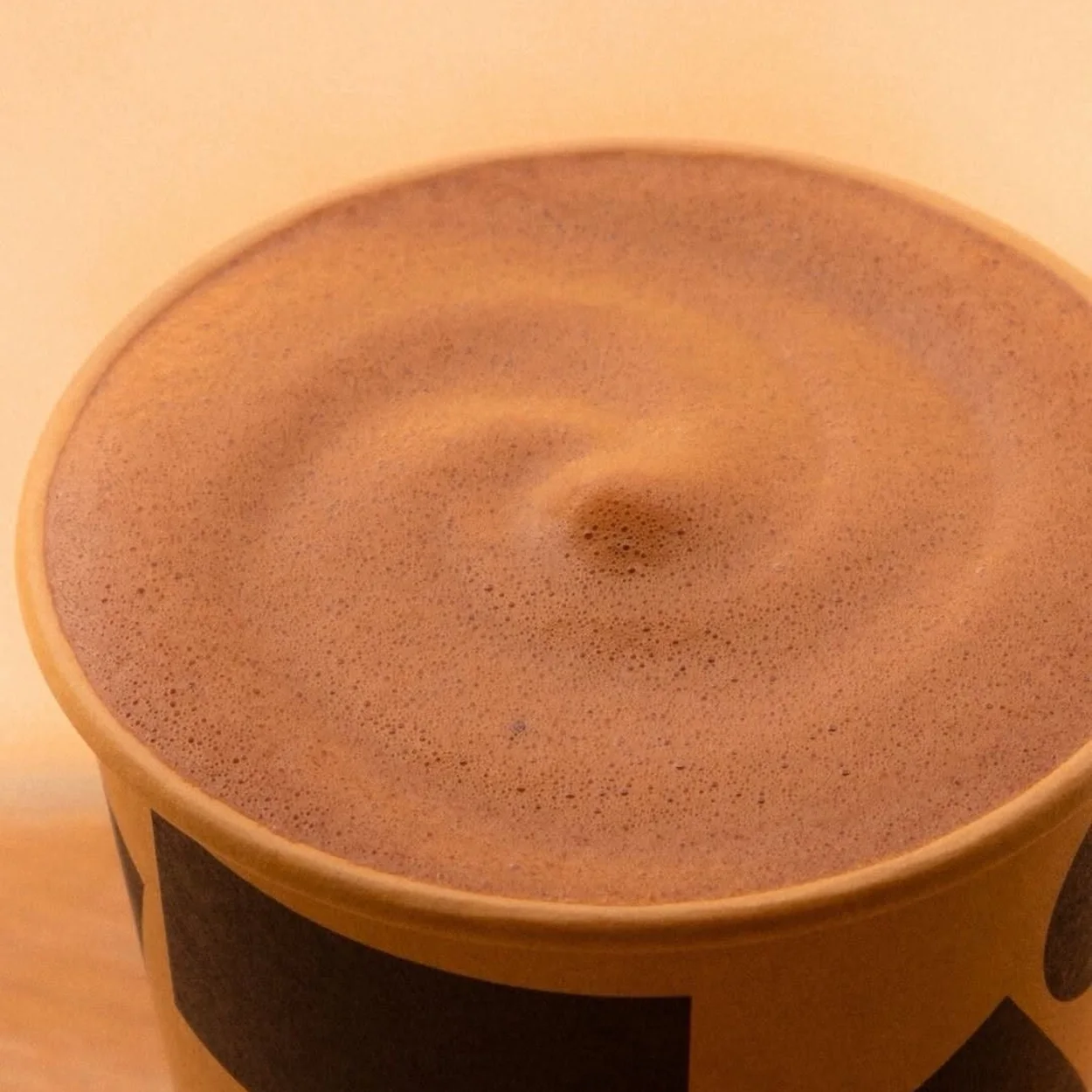 Close-up of the frothed top of a Knoops hot chocolate