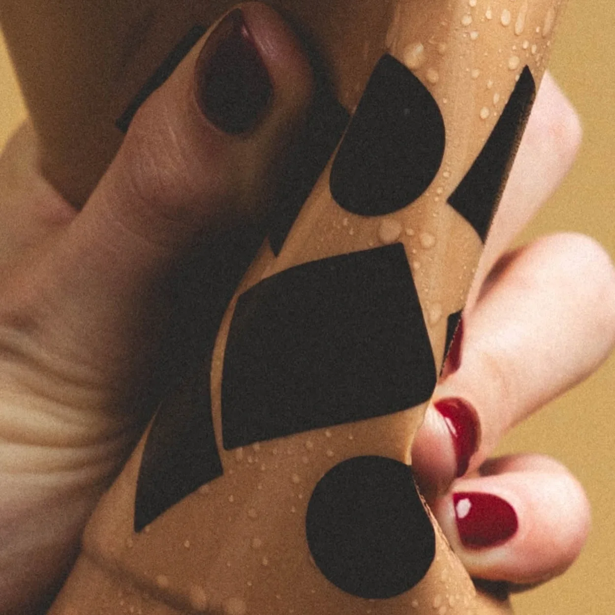 Hand holding a Knoops takeaway cup of hot chocolate