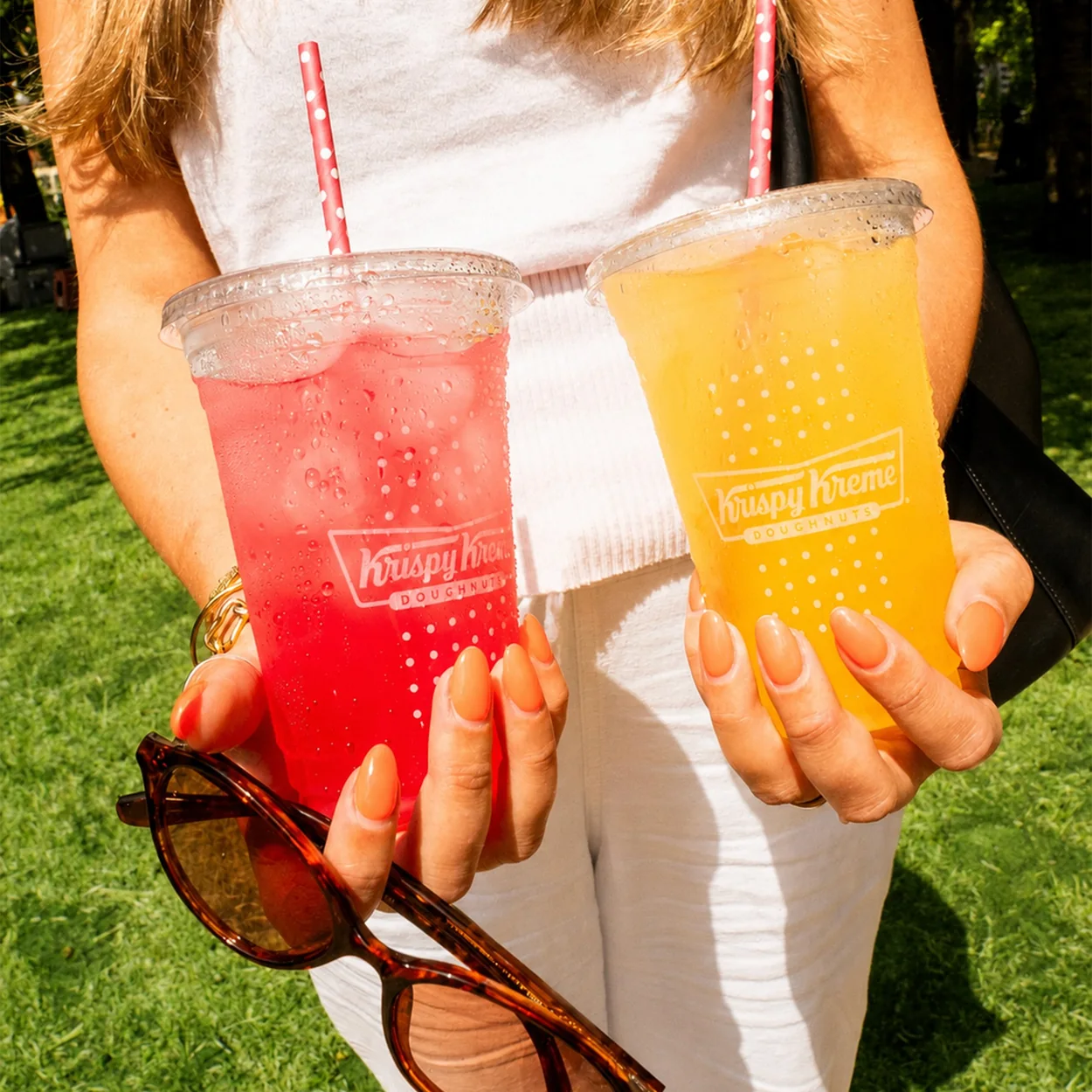 Krispy Kreme iced lemonade drinks held outdoors