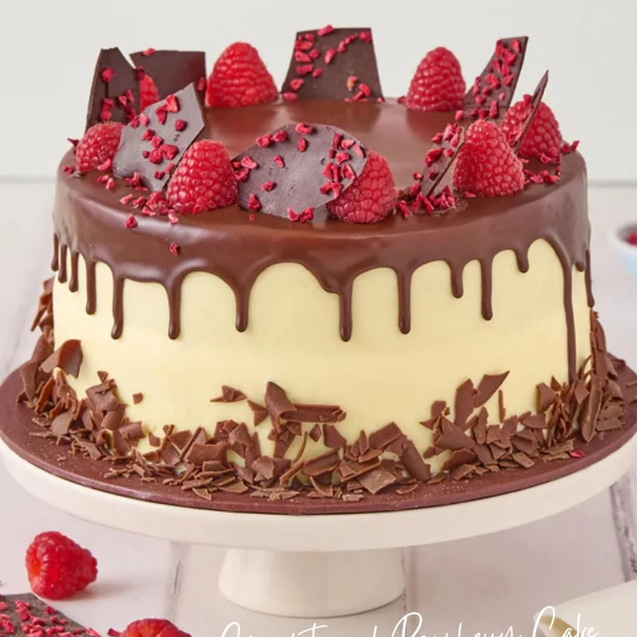 Lola's Cupcakes chocolate and raspberry drip cake