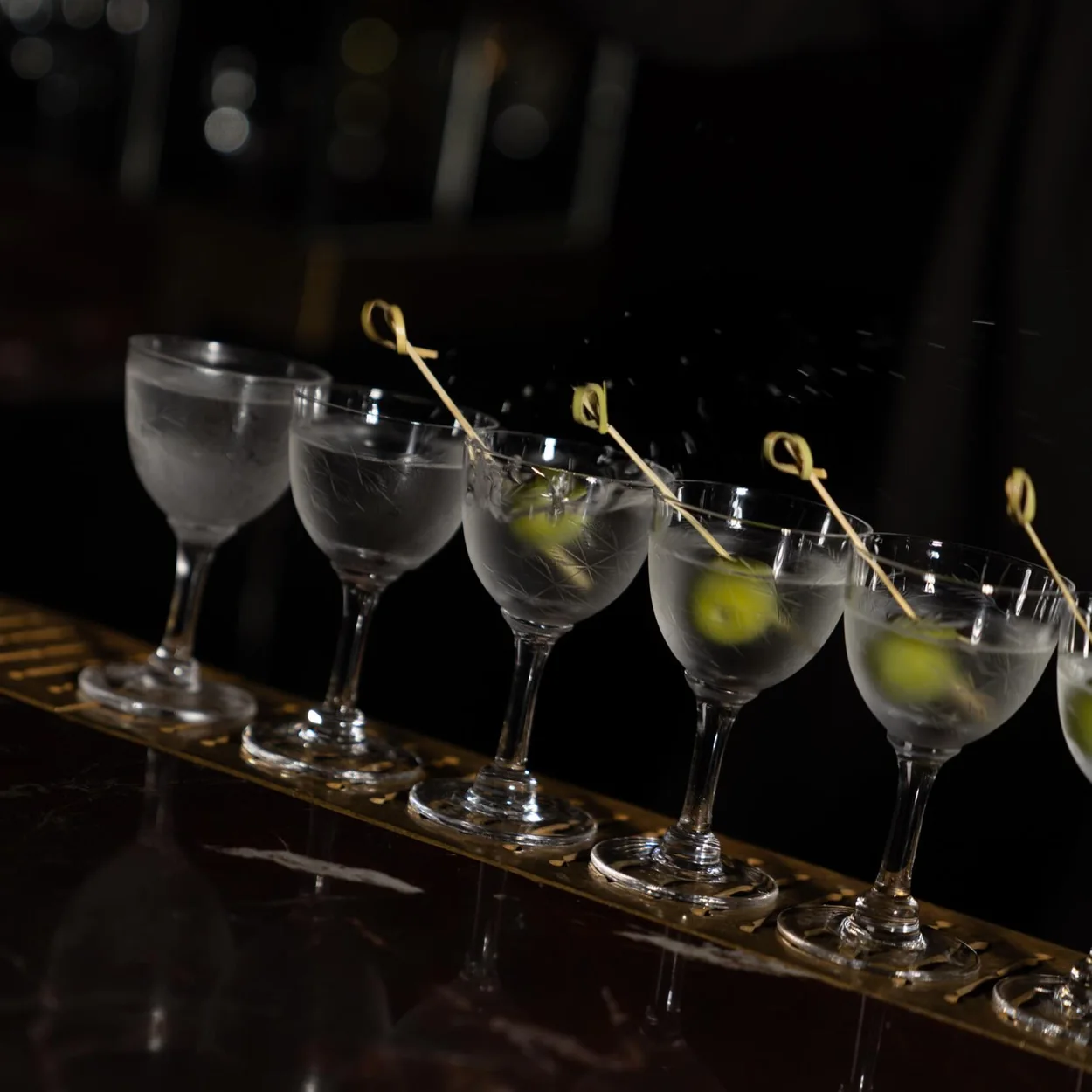 Louie row of martini cocktails on the bar