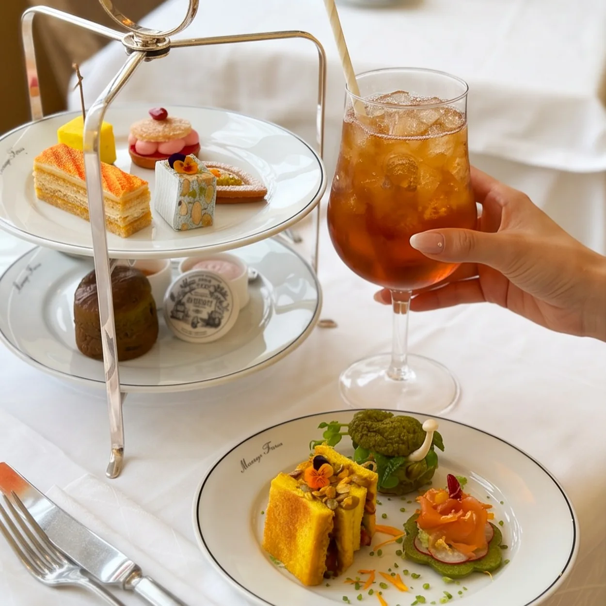 Mariage Freres afternoon tea stand with pastries and iced tea