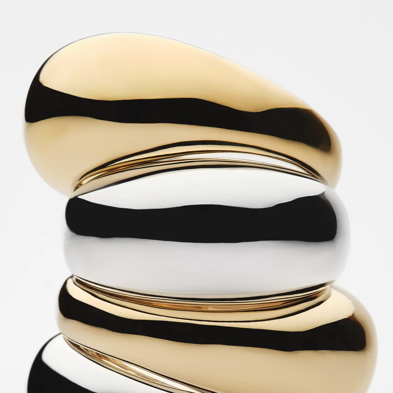 Mejuri Dome collection rings in gold and silver