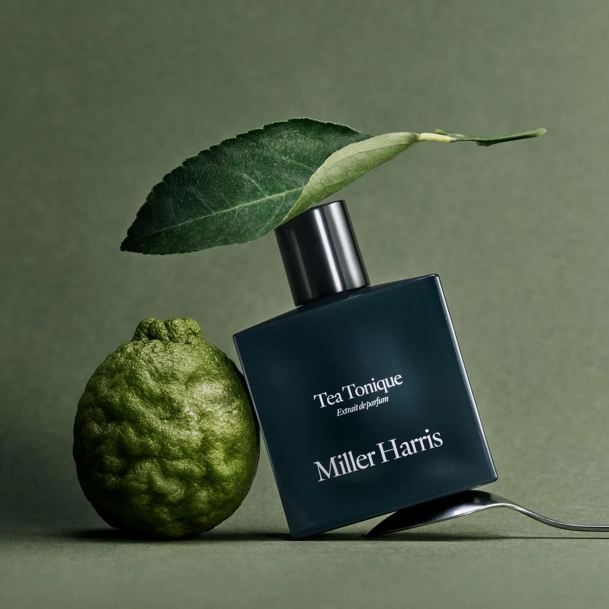 Miller Harris Tea Tonique bottle with a bergamot fruit