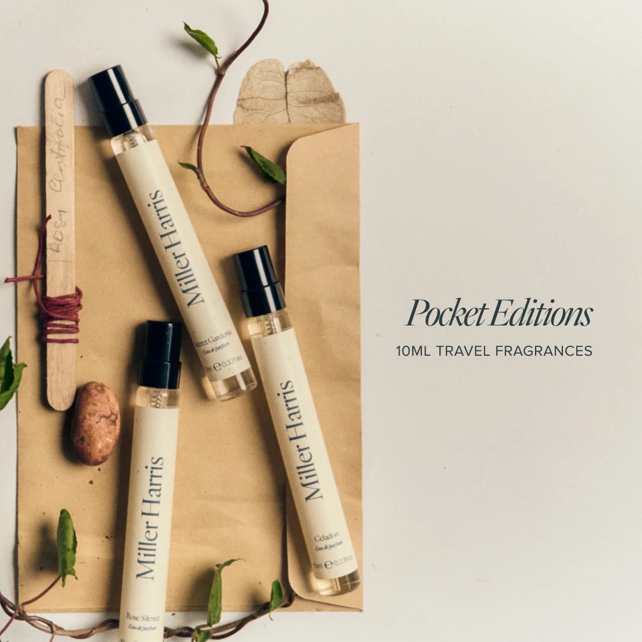 Miller Harris Pocket Editions travel-size fragrances laid on paper