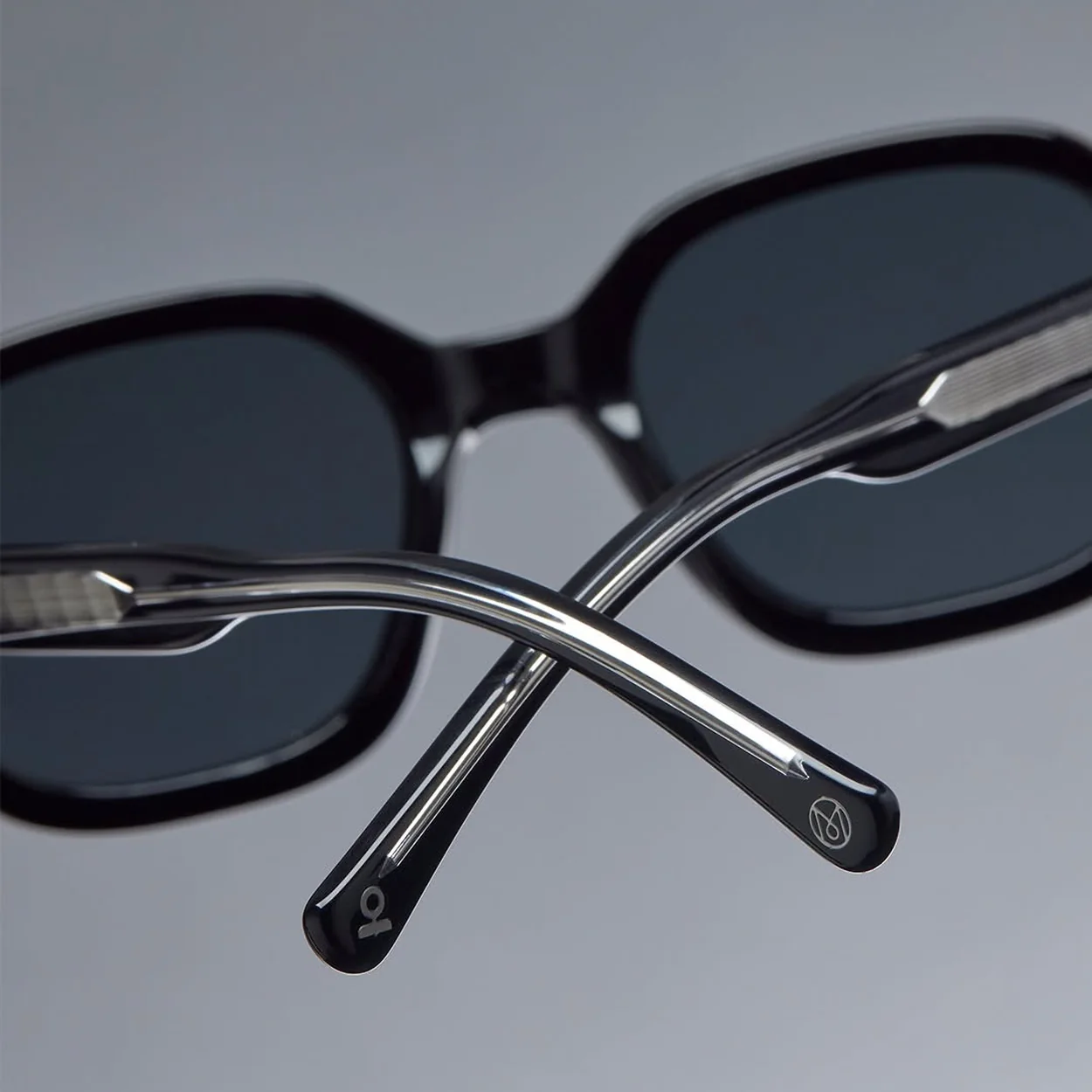 MONC folded black sunglasses showing the frame detail