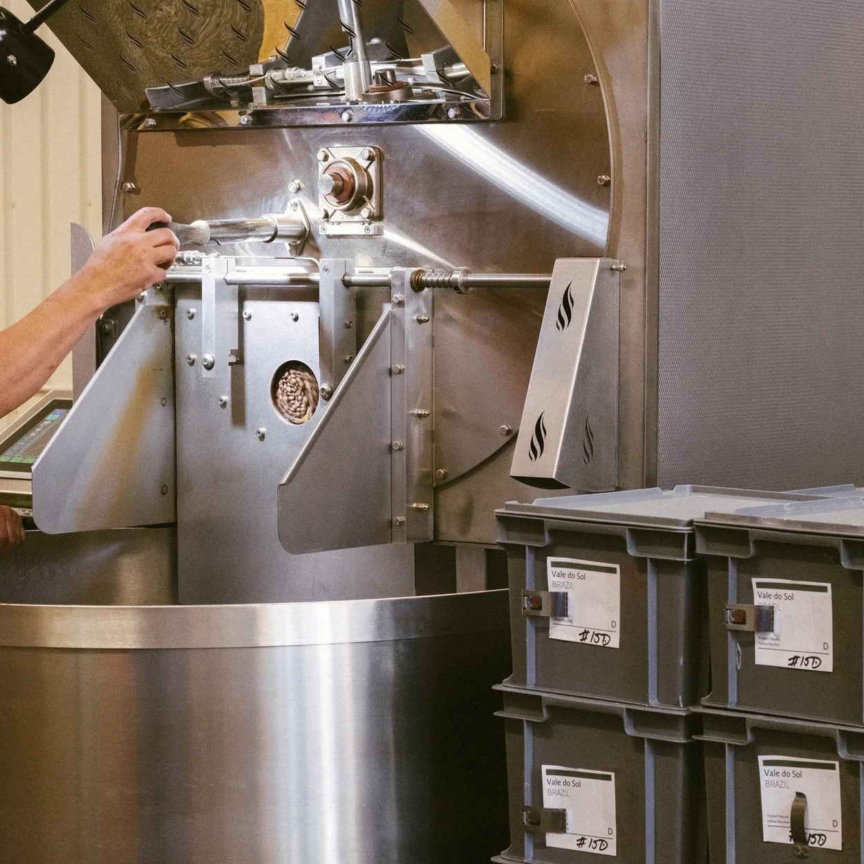 Monmouth Coffee drum roaster releasing a fresh batch of beans