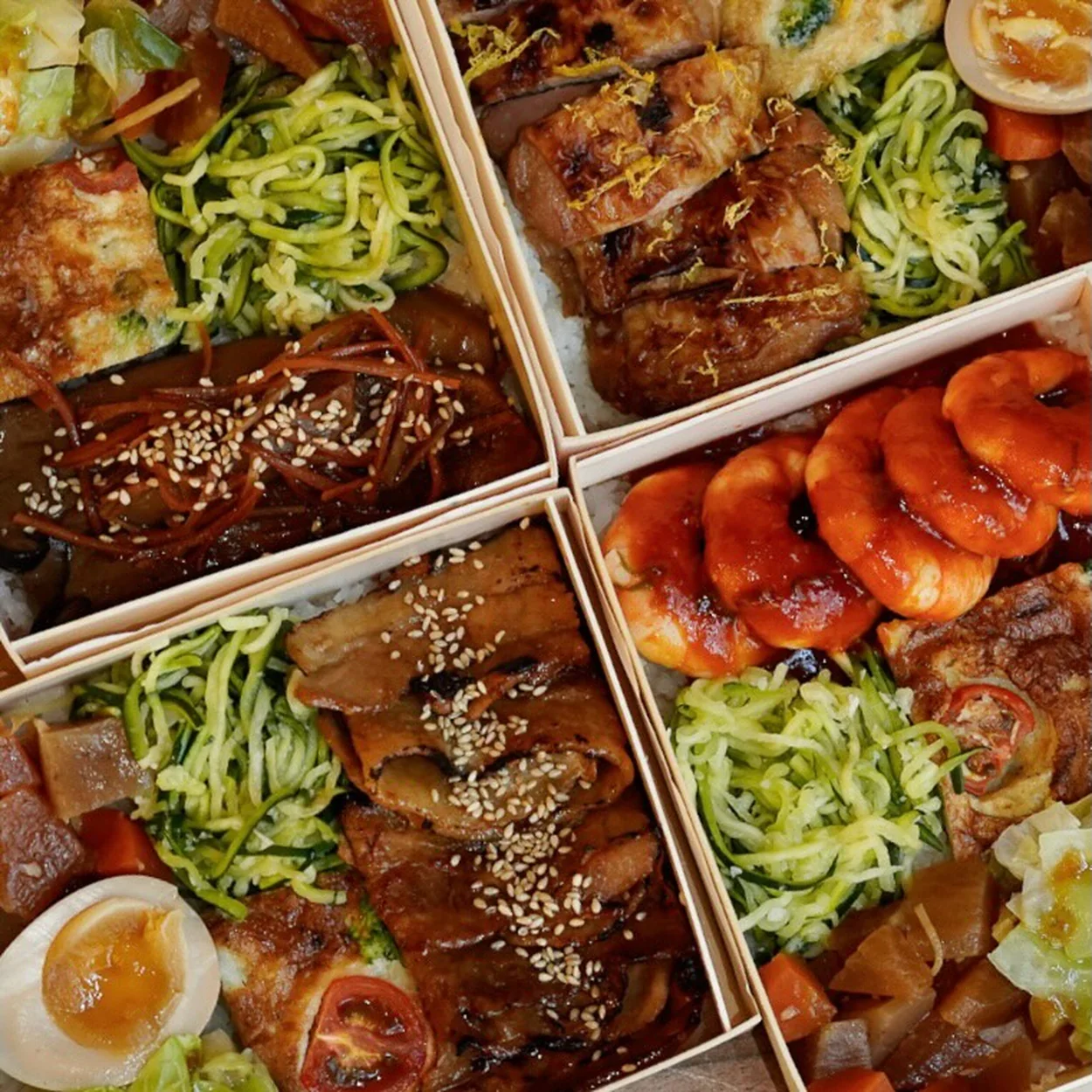 Moto obento boxes with teriyaki, egg and vegetables