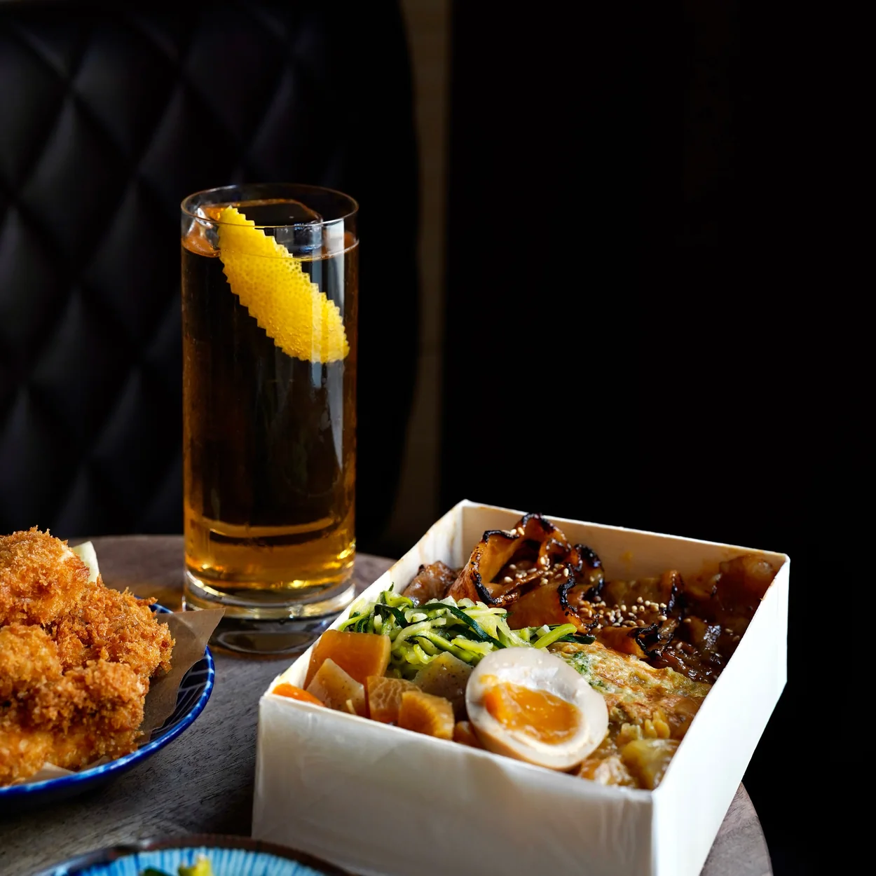 Moto obento box with a highball cocktail