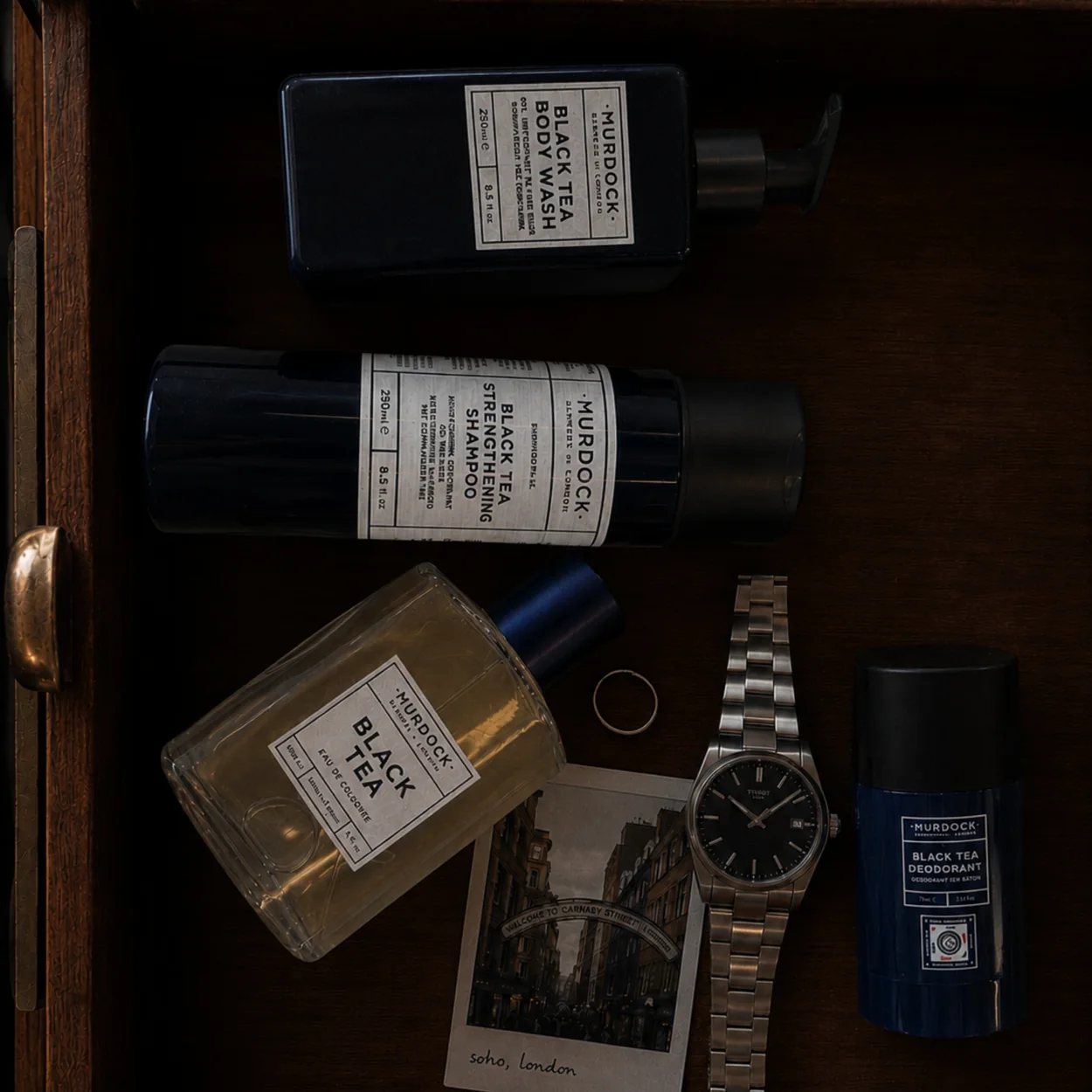 Murdock London grooming products laid out in a wooden drawer