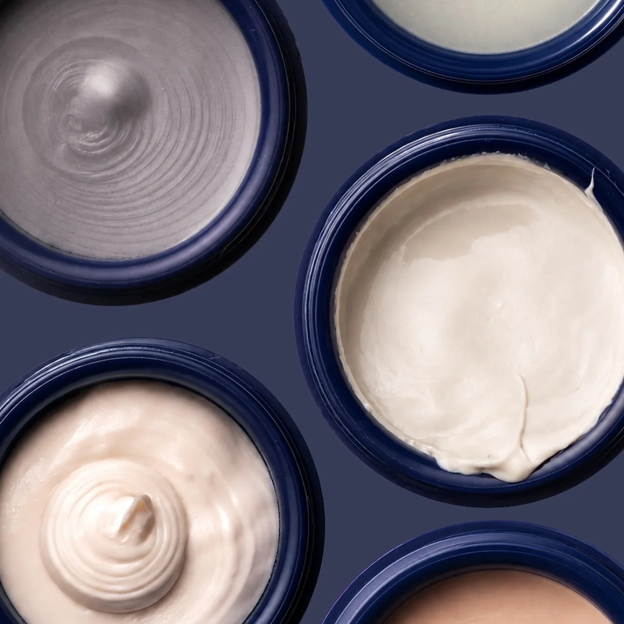 Murdock London shaving creams and balms in navy pots