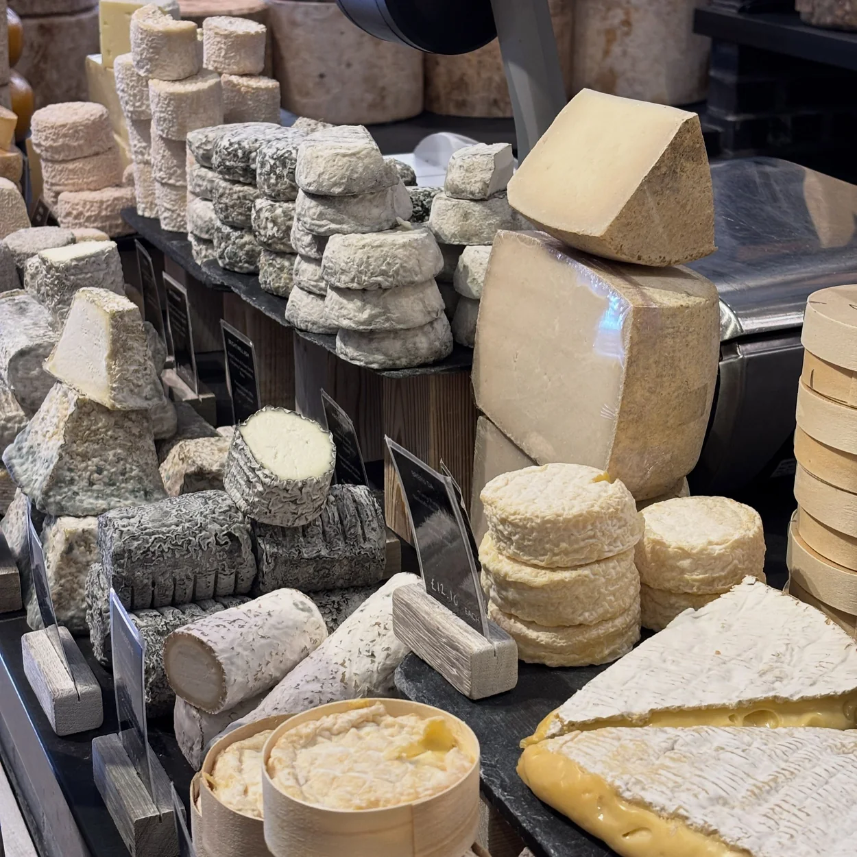 Neal's Yard Dairy cheese counter with soft and hard British cheeses