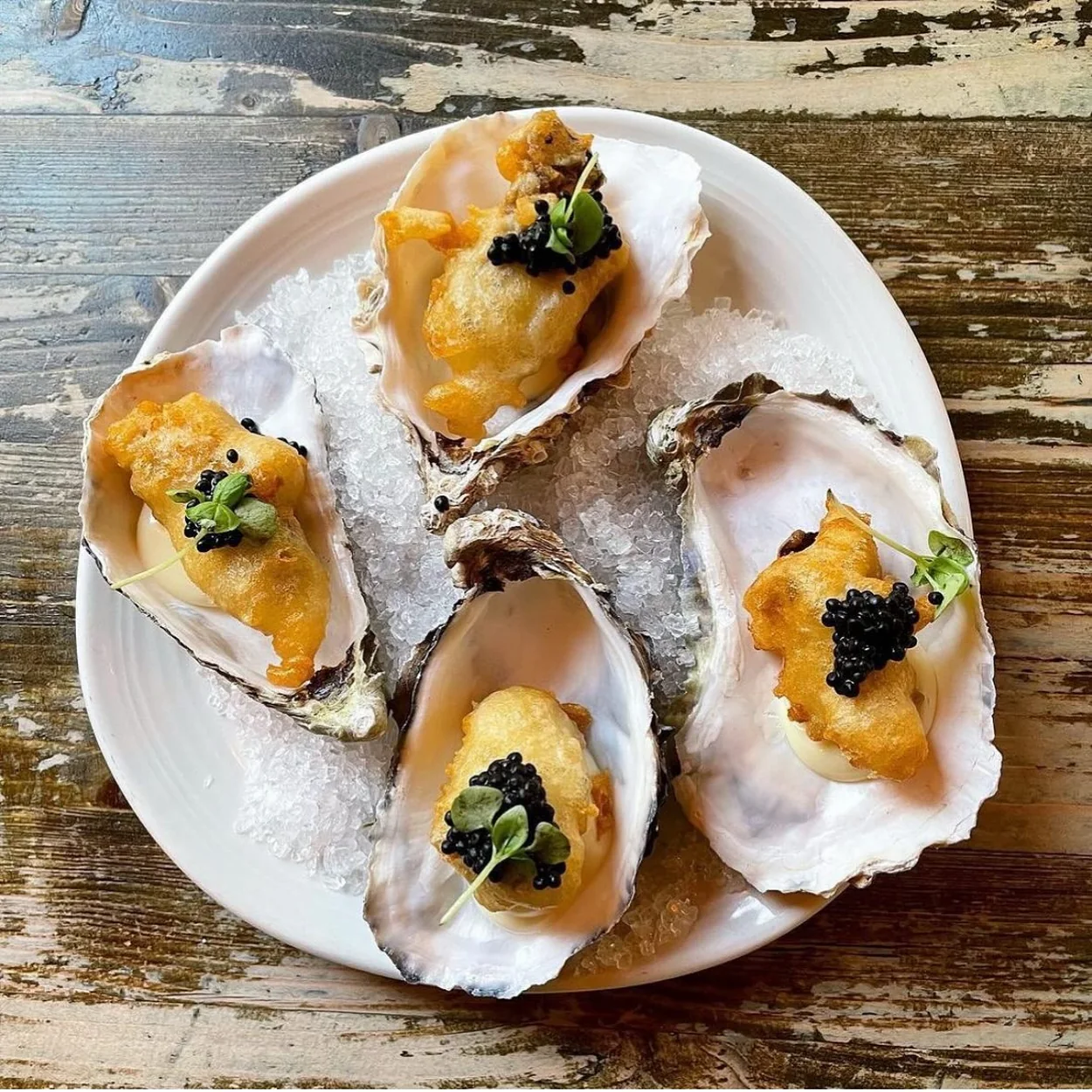 The Oystermen tempura oysters with caviar served on the shell