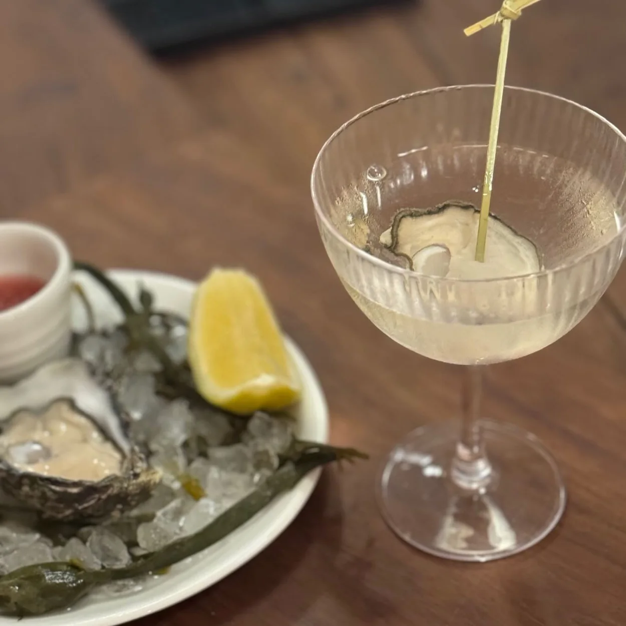 The Oystermen oyster on ice with lemon and a martini
