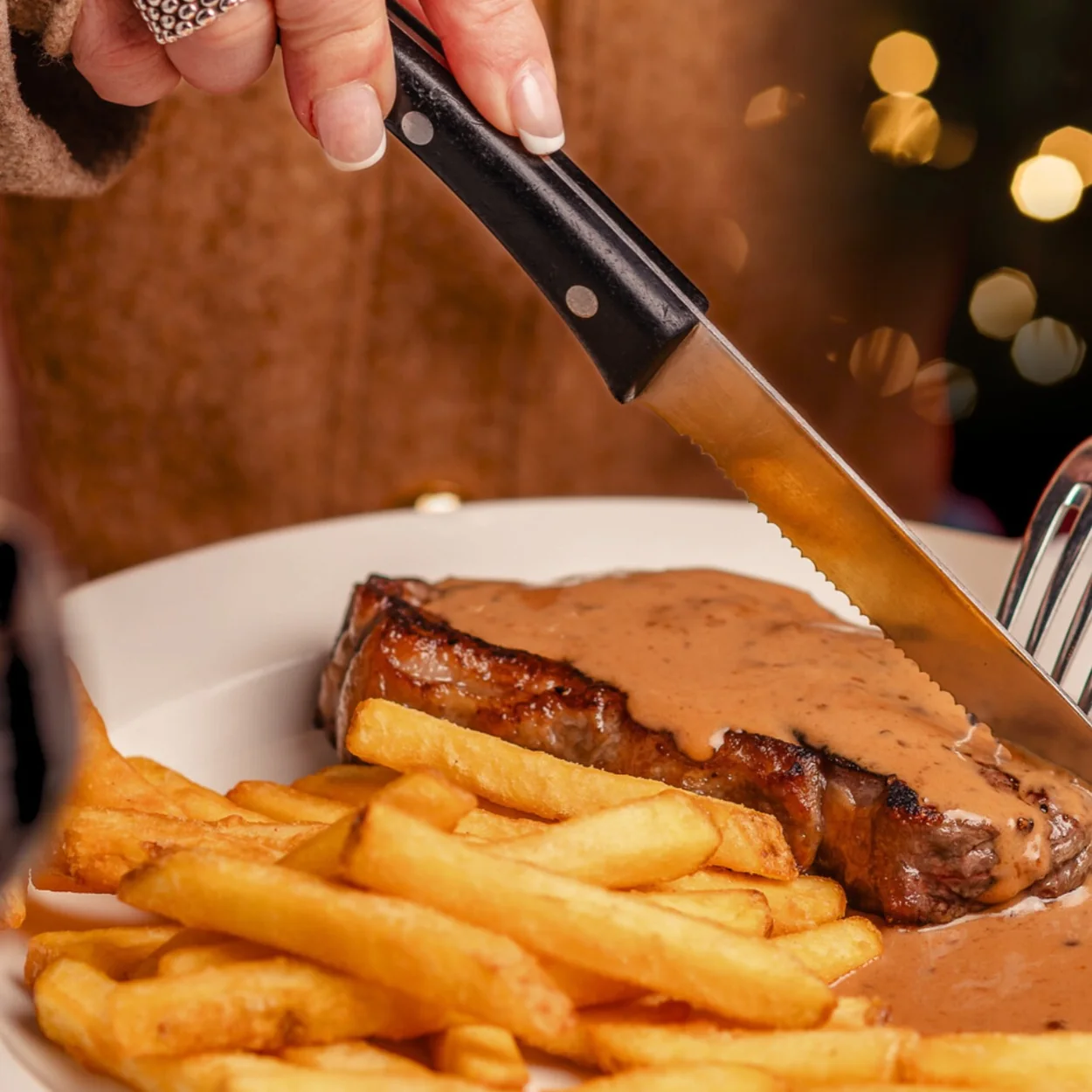 Palm Court Brasserie steak frites being sliced