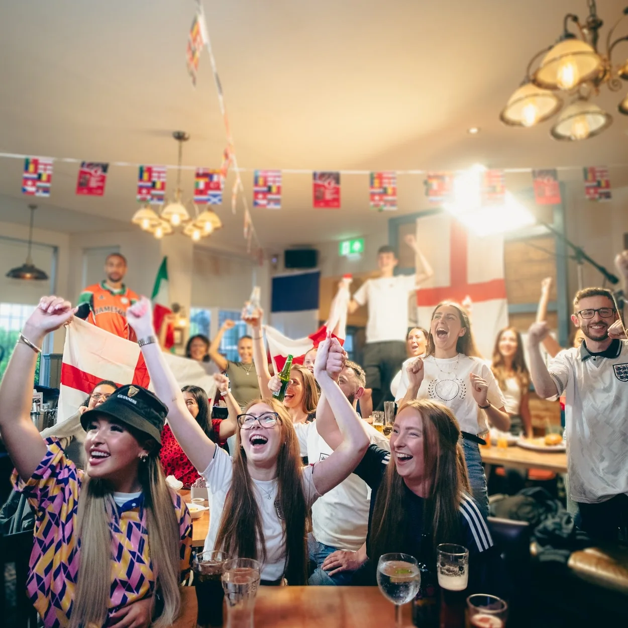 Fans watching live sport on the big screen at the Prince of Wales pub