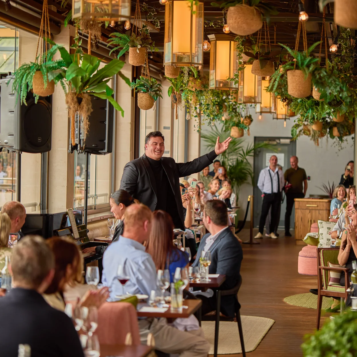 Royal Opera House restaurant interior with hanging plants and diners
