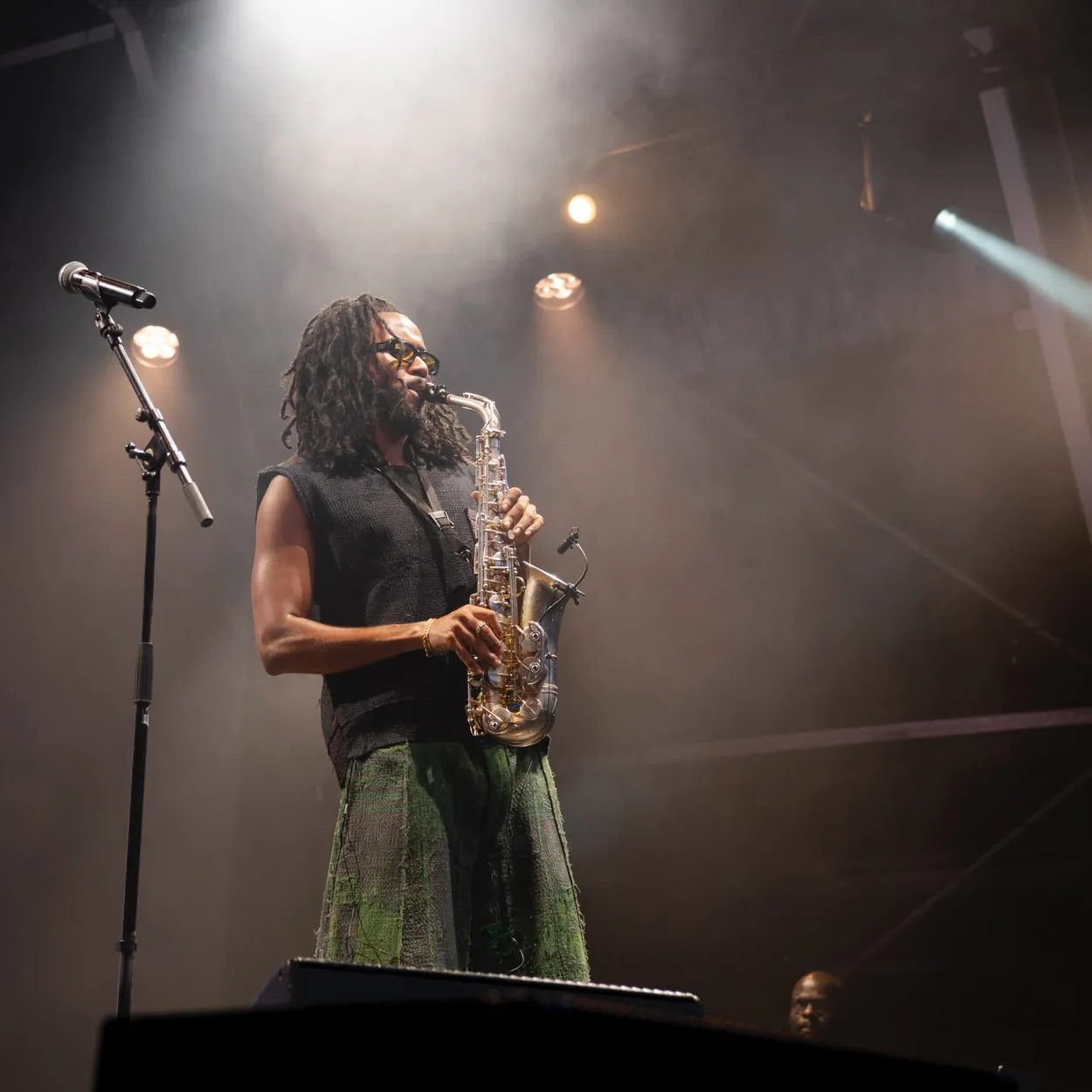 Saxophonist performing under stage lights at a Somerset House Summer Series show