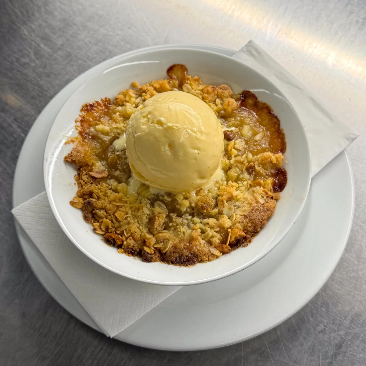 St. JOHN crumble pudding topped with ice cream