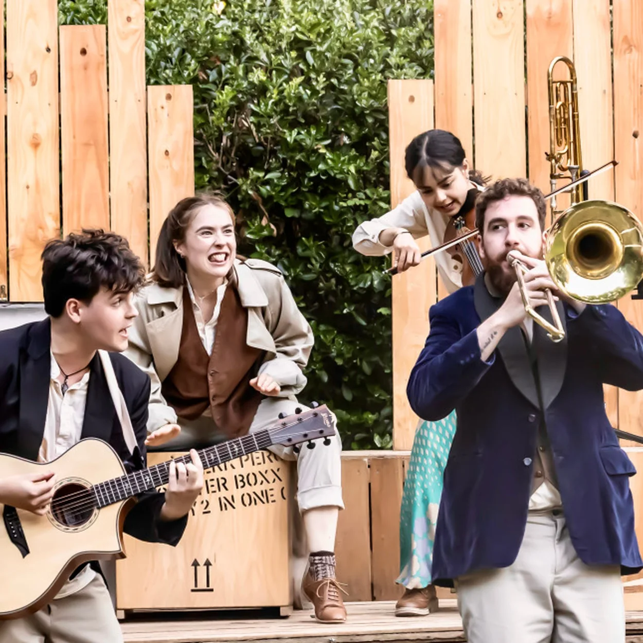 Actor-musicians performing on the outdoor stage at St Paul's, the Actors' Church