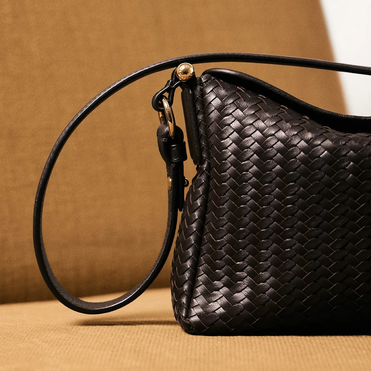 Strathberry woven black leather bag with slim shoulder strap