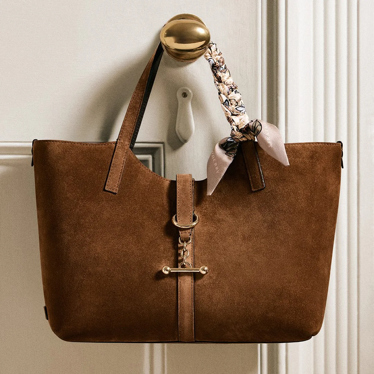 Strathberry brown suede tote with gold bar hardware and silk scarf detail