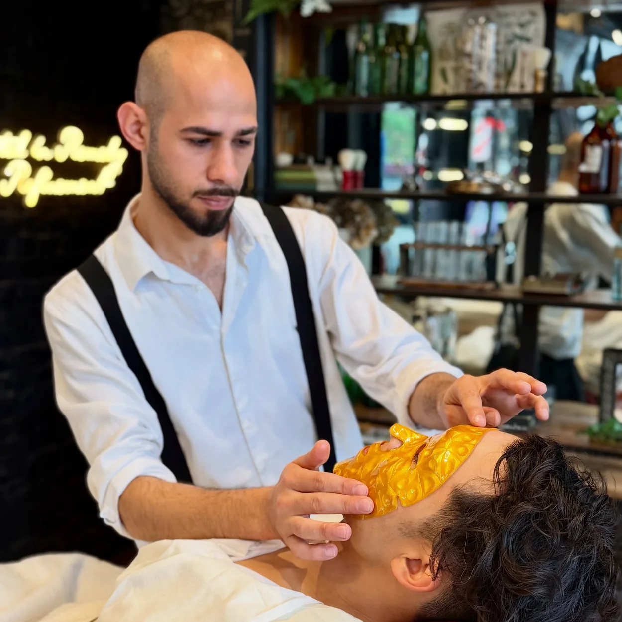 Ted's Grooming Room barber giving a hot towel treatment