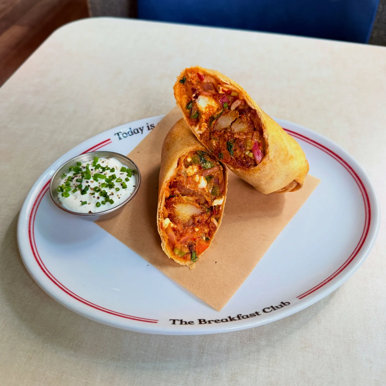 The Breakfast Club breakfast burrito with sour cream