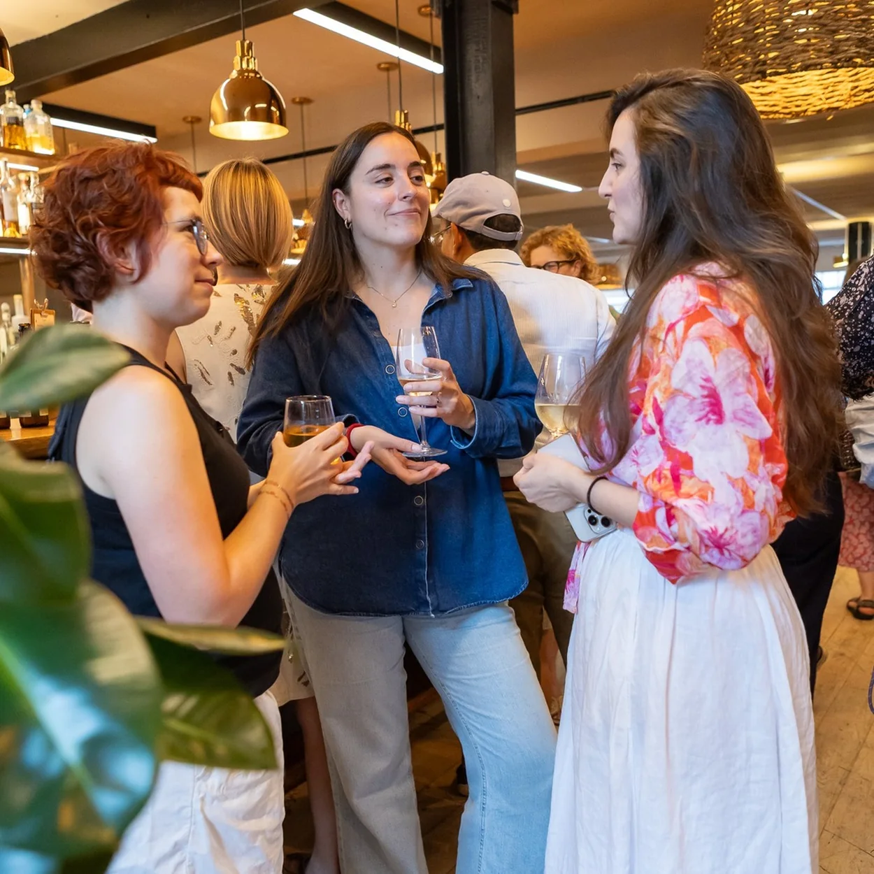 The Conduit members socialising at an evening event