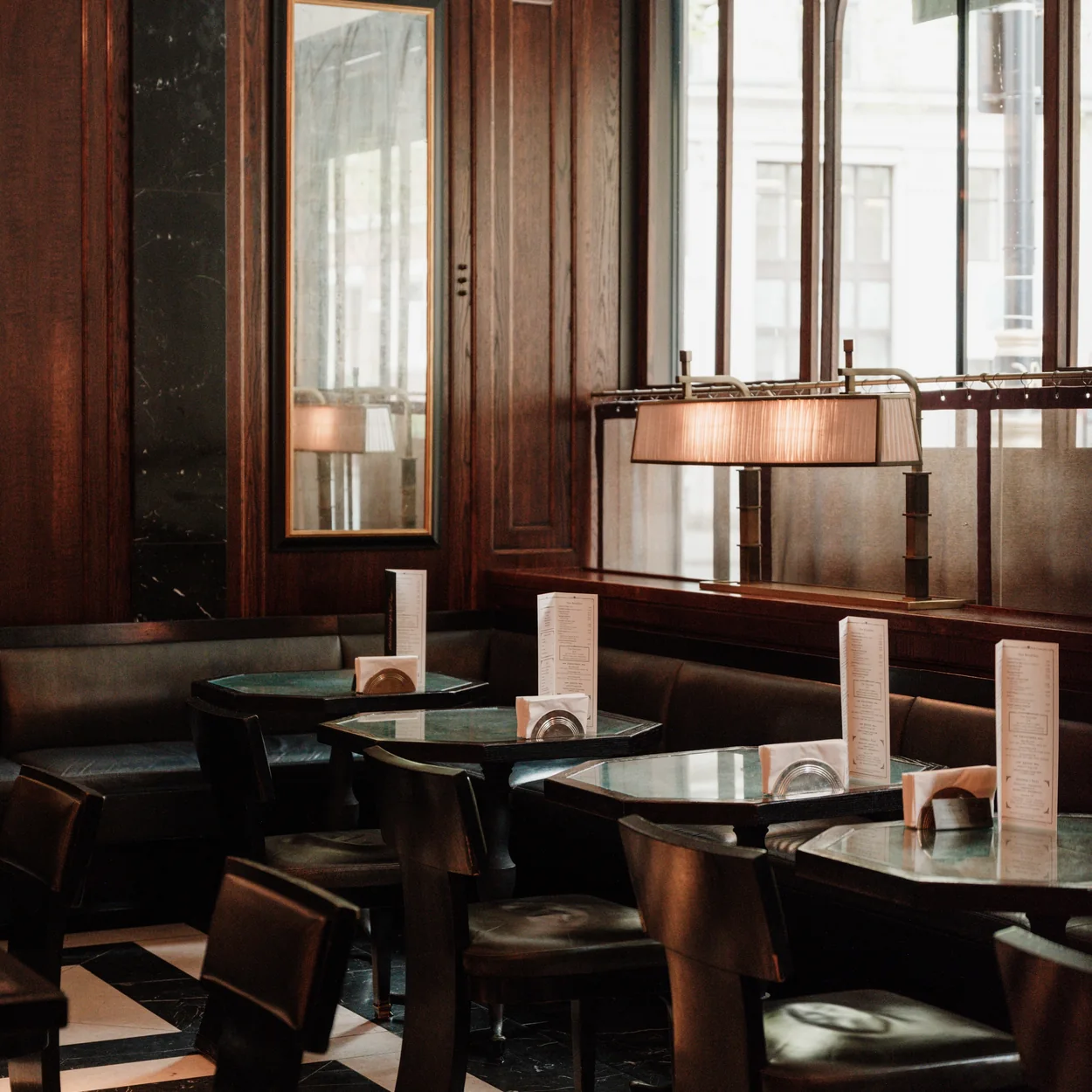 The Delaunay leather banquettes and dark wood booths