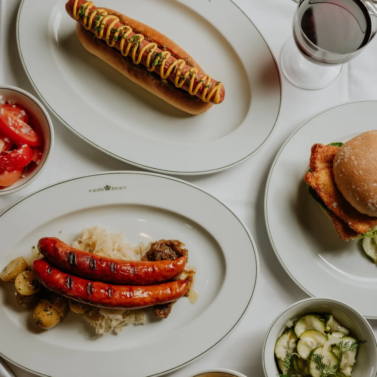 The Delaunay wieners and hot dog with potato salad and cucumber