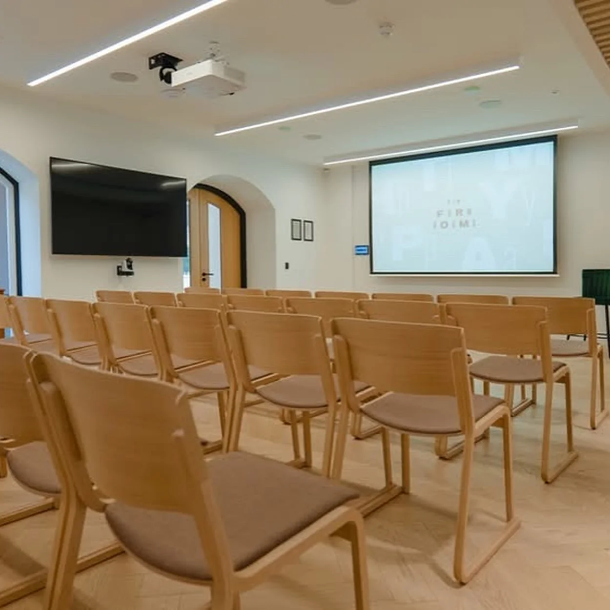 The Form Rooms meeting room set theatre style with screen