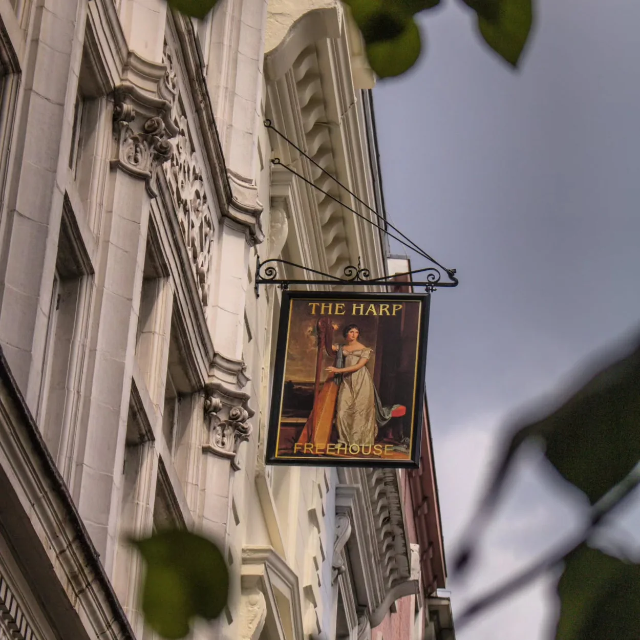The Harp hanging pub sign on Chandos Place