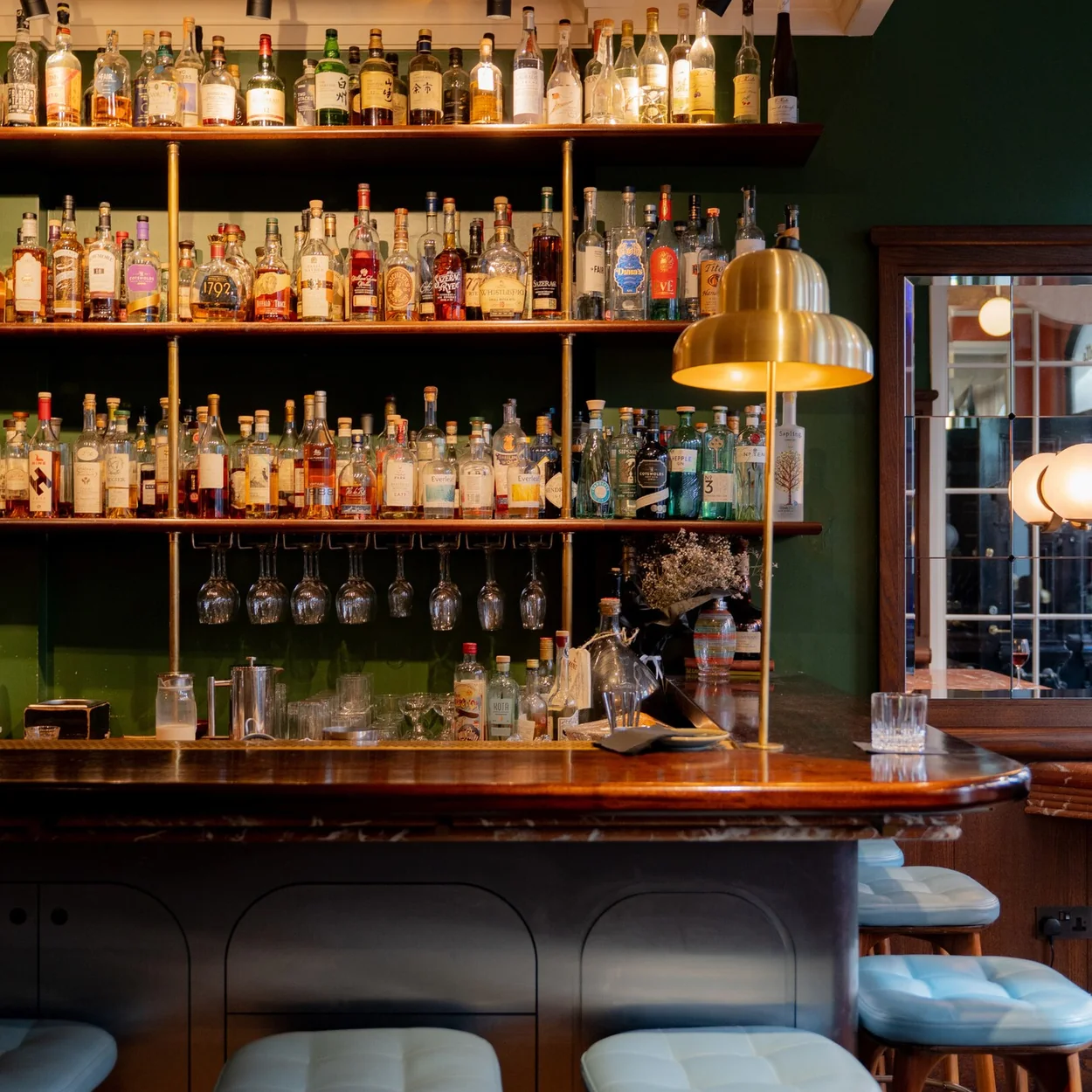 Henrietta Hotel ground-floor bar with back-lit spirits shelves