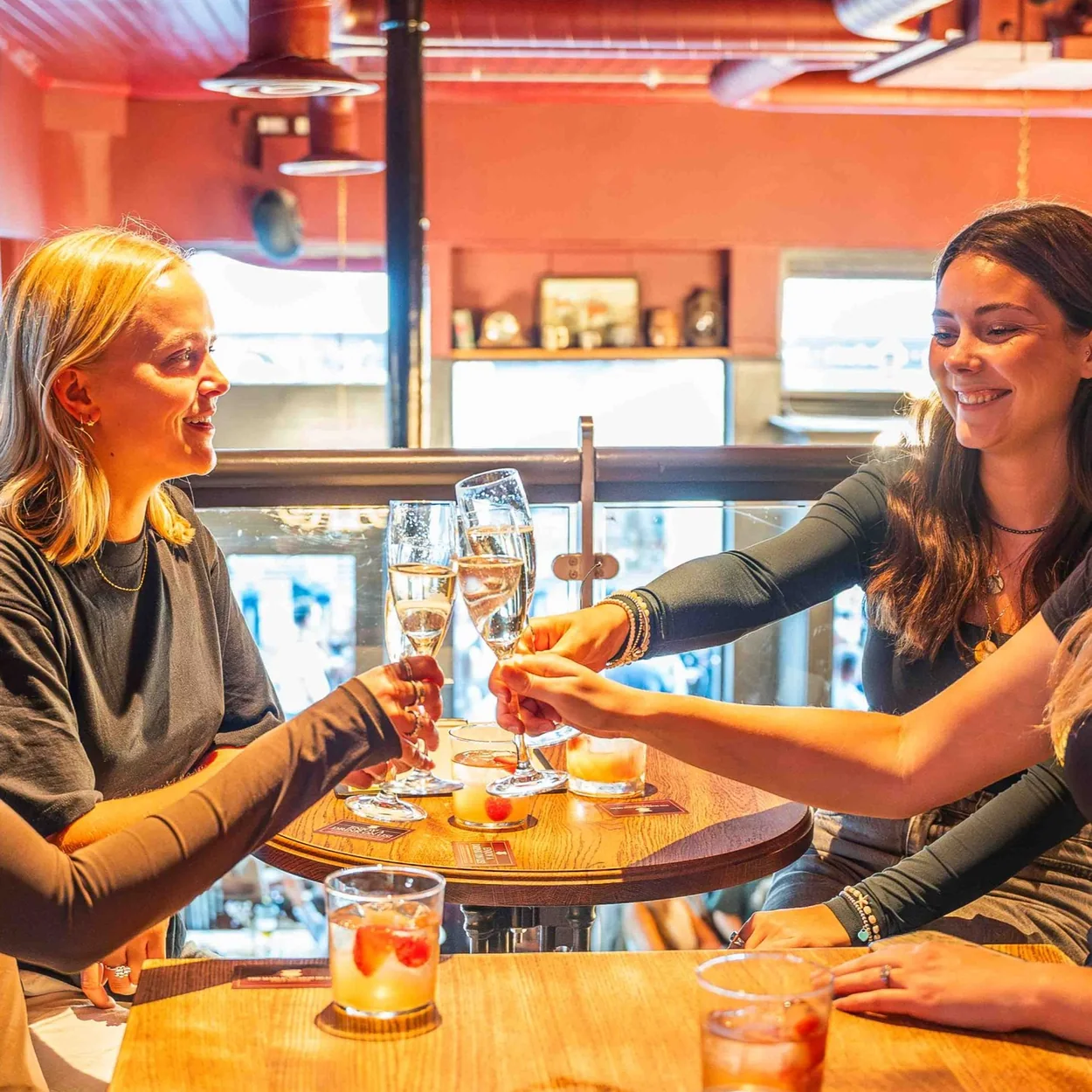 The Marlborough Head friends sharing drinks at a wooden table