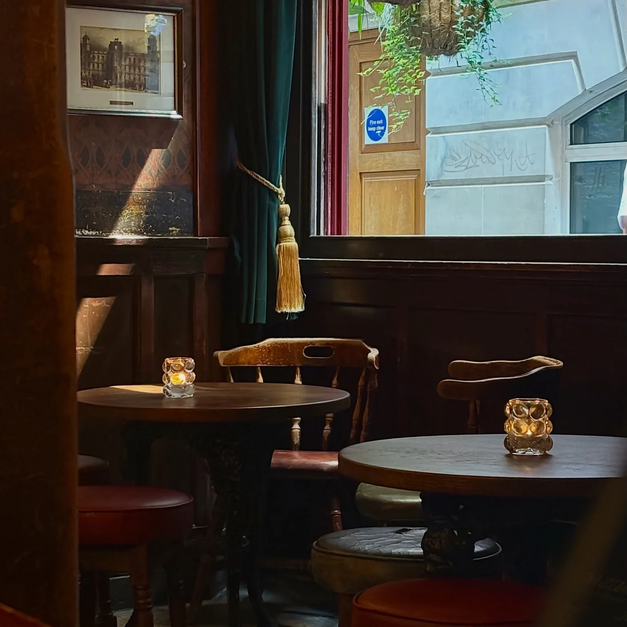 The Nell Gwynne Tavern wood-panelled interior with candlelit tables