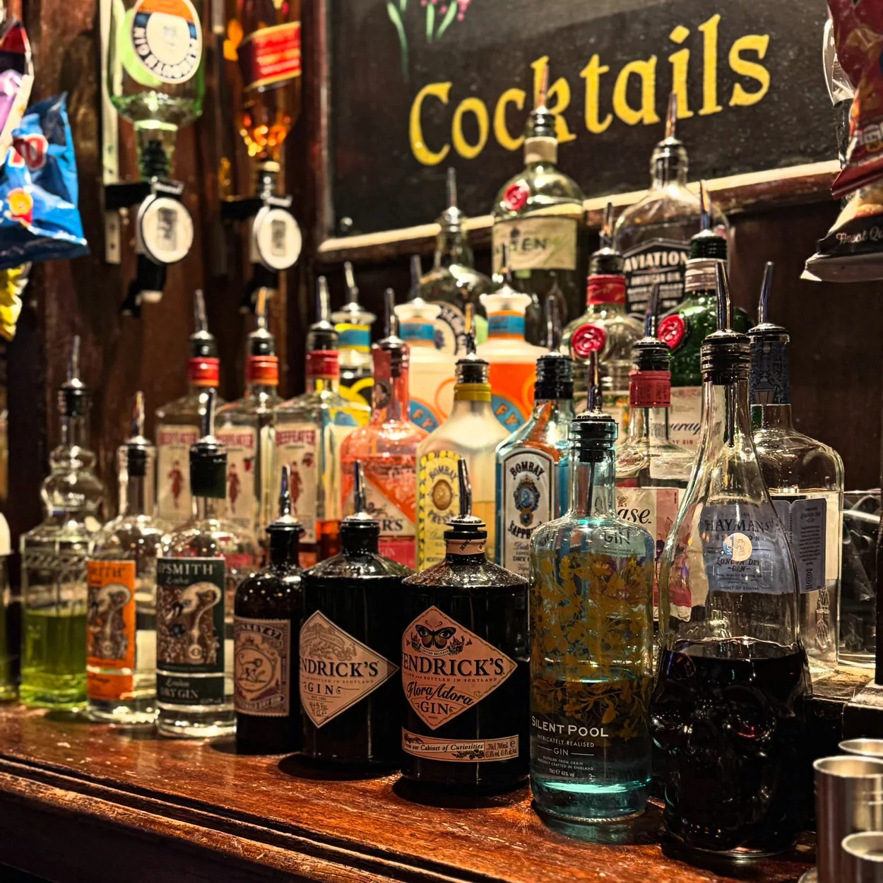 The Nell Gwynne Tavern back bar with gins and cocktail spirits
