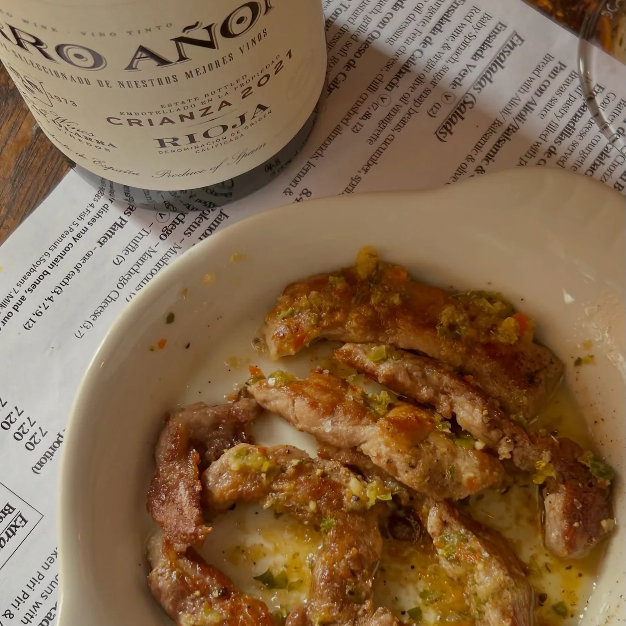 The Port House tapas plate with a bottle of Rioja
